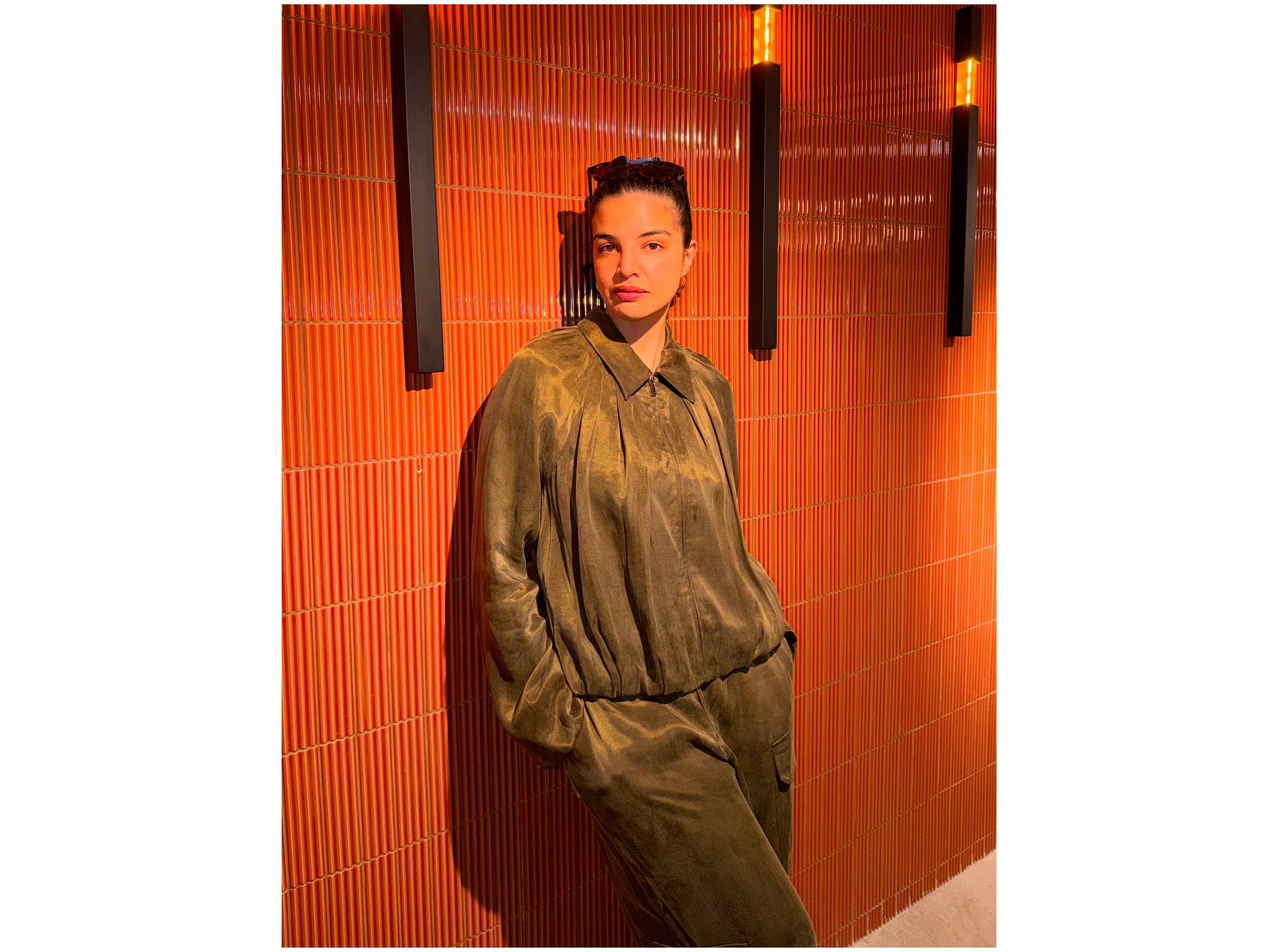 Emma Breschi standing against wall